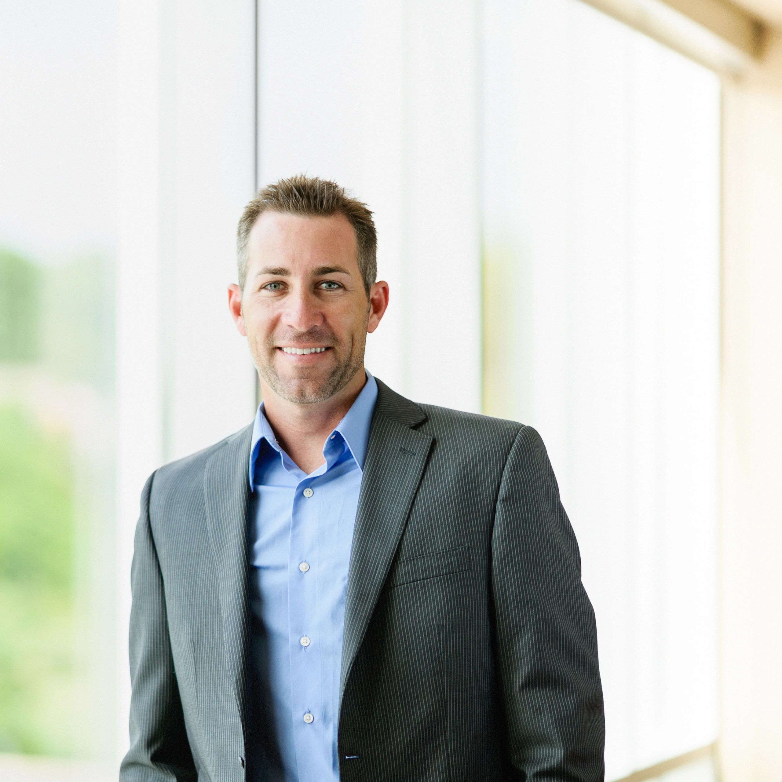 Professional headshot of a business leader